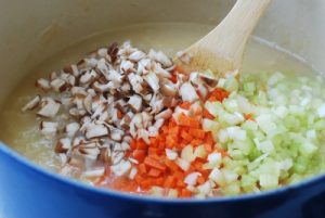 Chopped vegetables in the chicken porridge