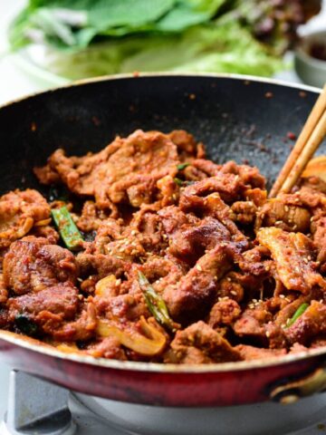 Stir-frying Korean spicy pork in a pan