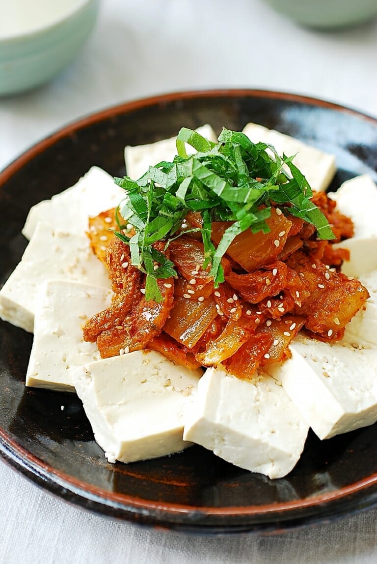 Stir-fried kimchi and pork served with boiled tofu