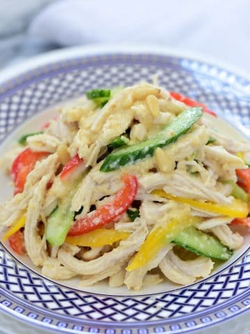 Korean Chicken Salad Mixed with Pine Nut Dressing, cucumber and bell pepper slices