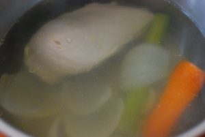 Poaching a chicken breast in a pot
