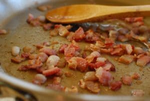 frying up bacon pieces for kimchi fried rice