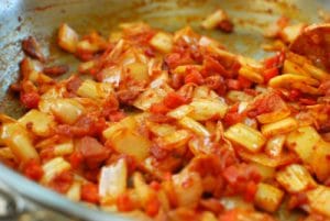 Stir-frying kimchi with bacon