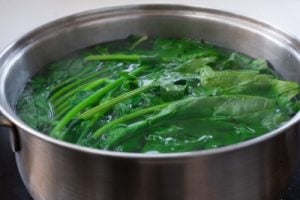 blanching spinach in a pot