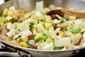 Stir-frying pork and vegetables for Korean black bean noodles