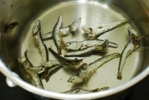 Making anchovy broth in a pot