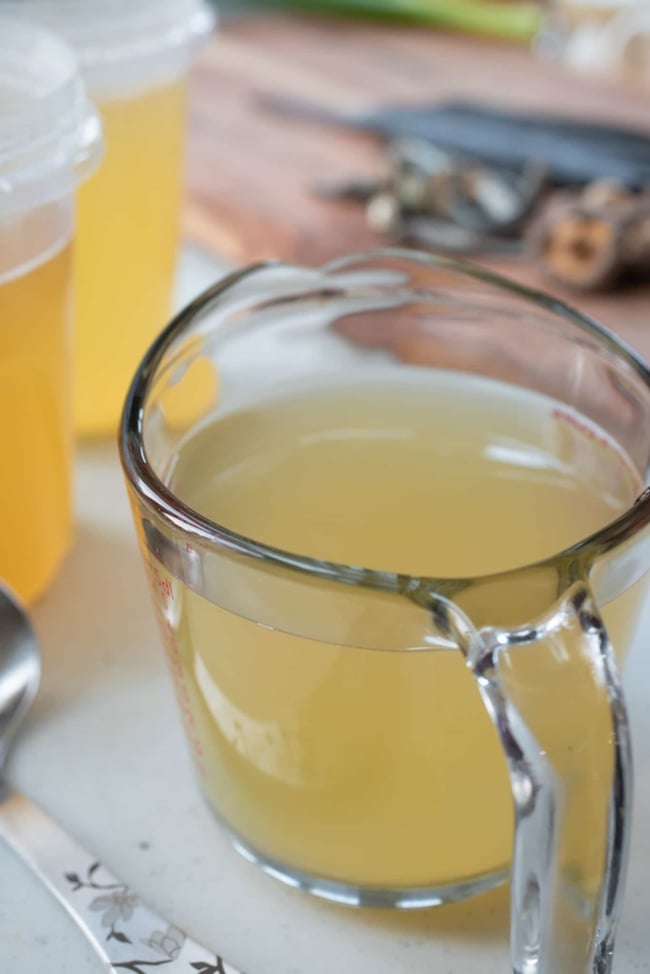 Korean anchovy broth in a measuring cup