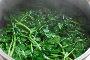 blanching watercress in a pot