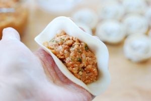 wrapping kimchi dumplings