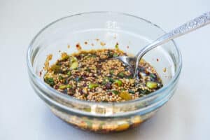 Korean soy based sauce with chopped scallions sesame seeds, etc.
