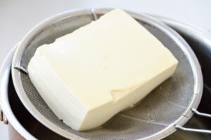 boiled tofu on a strainer