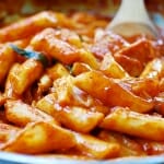 Korean rice cakes in a red spicy gochujang sauce