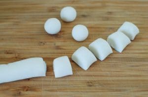 cutting and shaping rice batter into balls