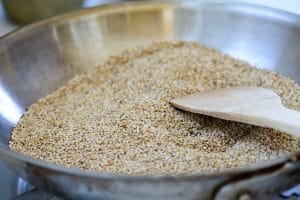 toasting sesame seeds in a pan