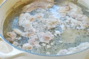 Ox bones being boiled in a stock pot