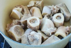 parboiled beef bones in a pot