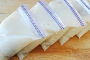 milky beef bone soup in freezer bags