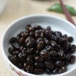 Soy braised black soybeans served in a small plate as a side dish
