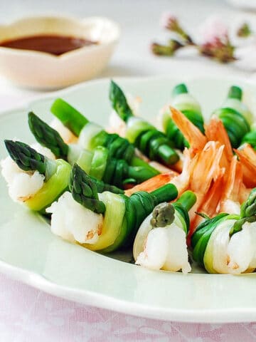 Shrimp and asparagus tied with green onions served with a gochujang sauce