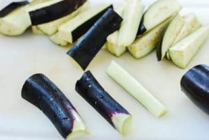 Cutting eggplants into bite size pieces