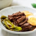 Korean soy braised beef served shredded along with egg slices and shishito peppers