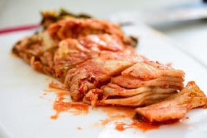 Cutting kimchi on a cutting board