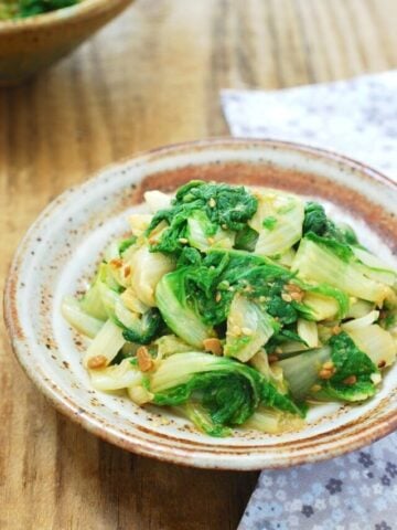 Korean young napa cabbage seasoned with doenjang (fermented soybean paste) served in a small ceramic bowl