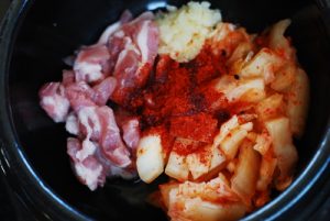 Kimchi soondubu ingredients in the pot