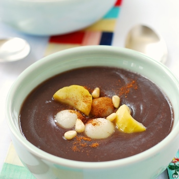 Korean Sweet red bean porridge topped with chestnuts, pine nuts, and rice balls