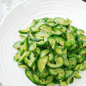 Stir-fried cucumber side dish in a white plate