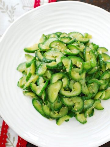 Stir-fried cucumber side dish in a white plate