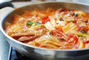 Boiling a stew with kimchi and other ingredients