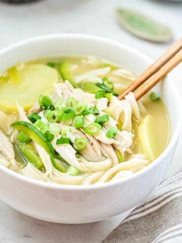 Korean knife-cut noodle soup with chicken, potato, and zucchini