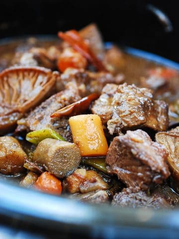 Korean braised shank meat with root vegetables in the slow cooker