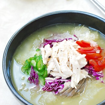 Chilled Korean Chicken Soup served with shredded chicken and vegetables