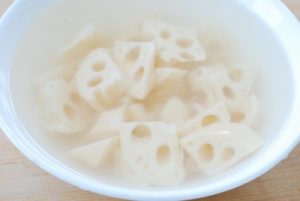 Stir-fried lotus root with peppers and mushrooms