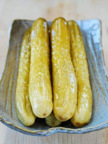 The long slender Korean salt pickled cucumbers in a large plate