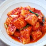 Cubed radish kimchi in a small bowl