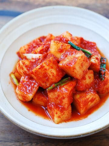 Cubed radish kimchi in a small bowl