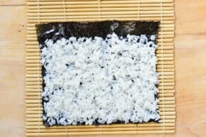spreading rice on a seaweed