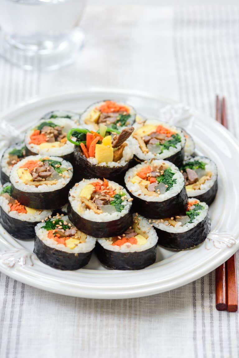 Korean rice rolls sliced and arranged on a plate