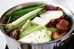 Vegetables in a large pot of water