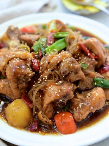 Soy sauce braised chicken pieces with vegetables and glass noodles