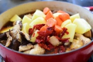 Chicken pieces in braising liquid