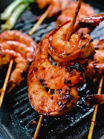 Red spicy gochujang skewered and grilled shrimp