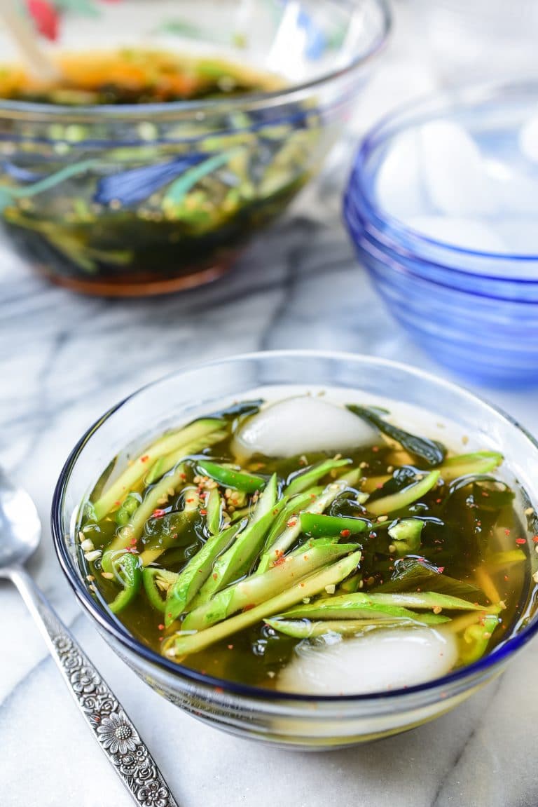 Korean cold cucumber soup in a glass bowl