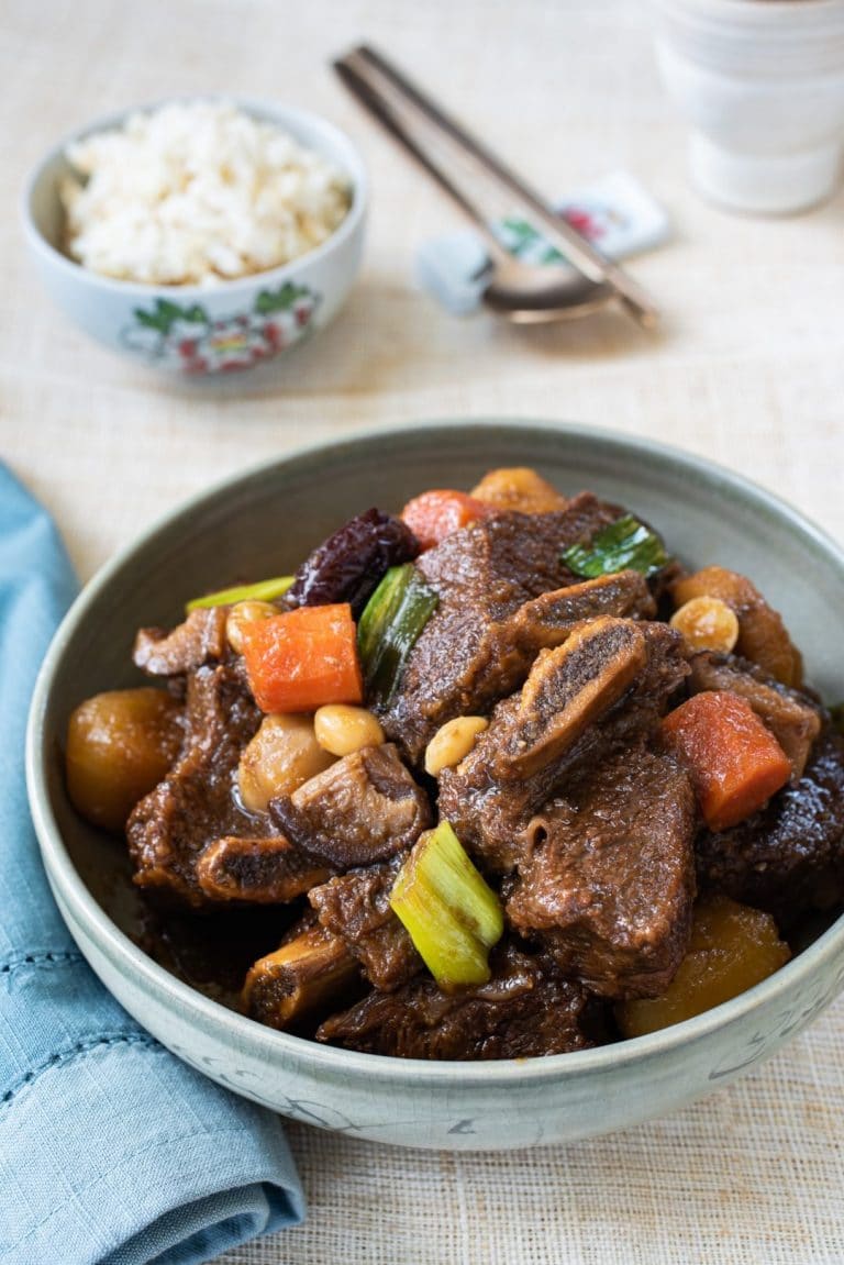 Korean braised beef short ribs served with a bowl of rice