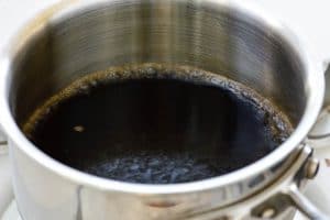 Soy sauce marinade being boiled in a sauce pan
