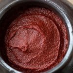 a closeup of Korean red chili paste in an earthenware