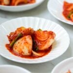Onion kimchi served in small white bowls